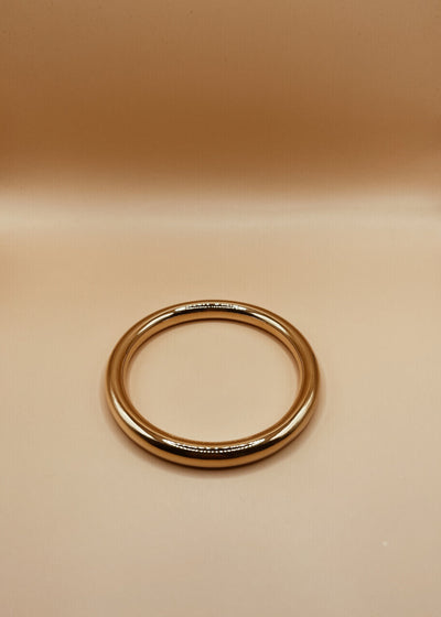 Roundabout Chimbai Bangle in Glossy Gold