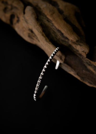 Single Line Pyramid Wrist Cuff in Silver Tone