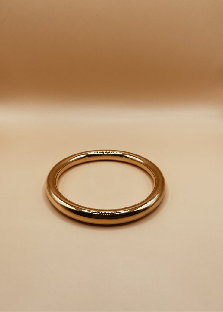 Roundabout Chimbai Bangle in Glossy Gold