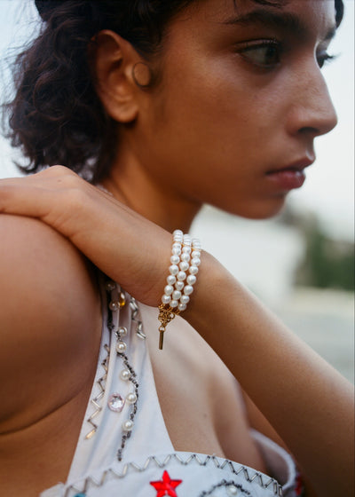 The Lune Three Row Pearl Bracelet In Gold Tone