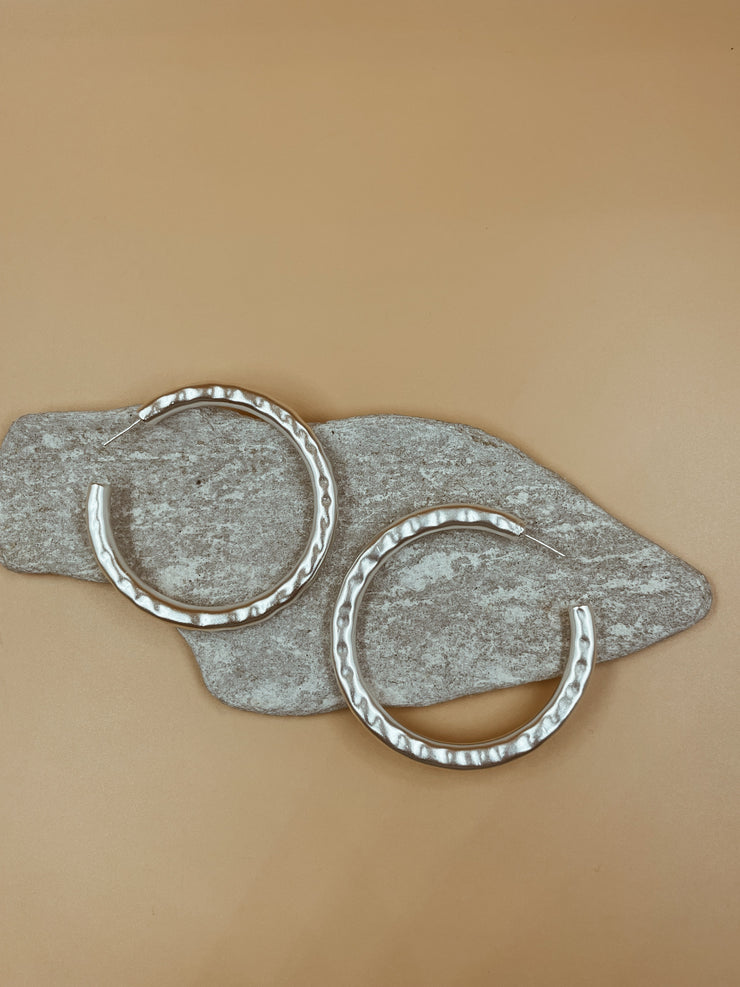 Lightly hammered ripple textured brass with silver rhodium plated big hoops. Chunky textured hoops that are light-weight and 90s inspired. AM to PM hoops suited for every occasion. Available in 3 ( three ) sizes - small, medium and big.  