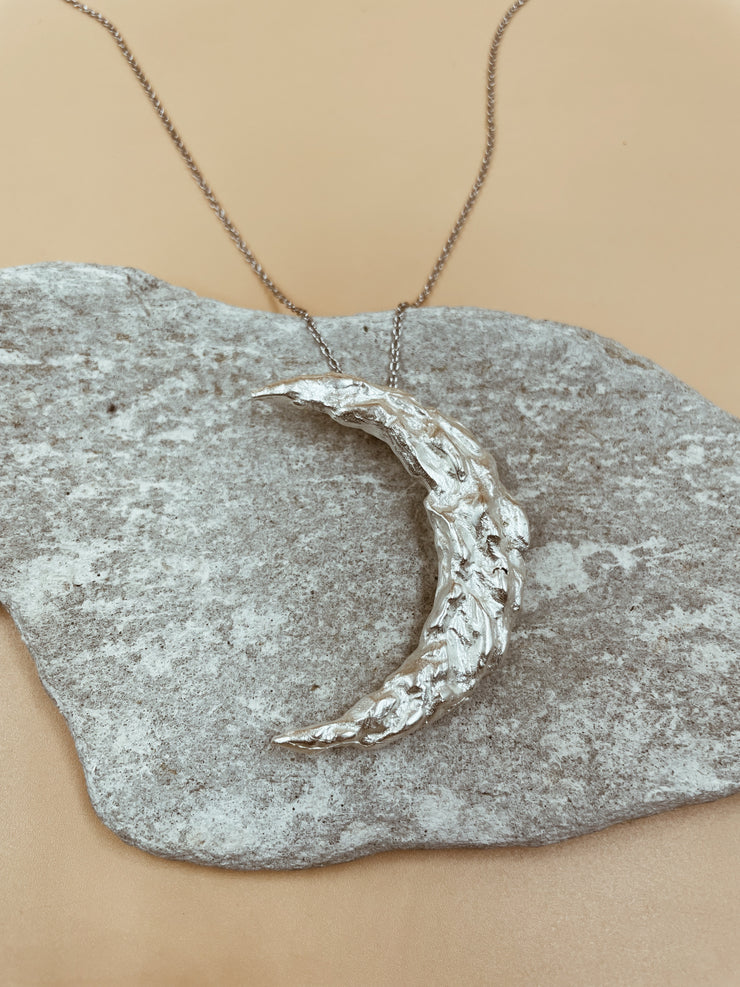 Wandering Crescent Moon Necklace in Silver Tone