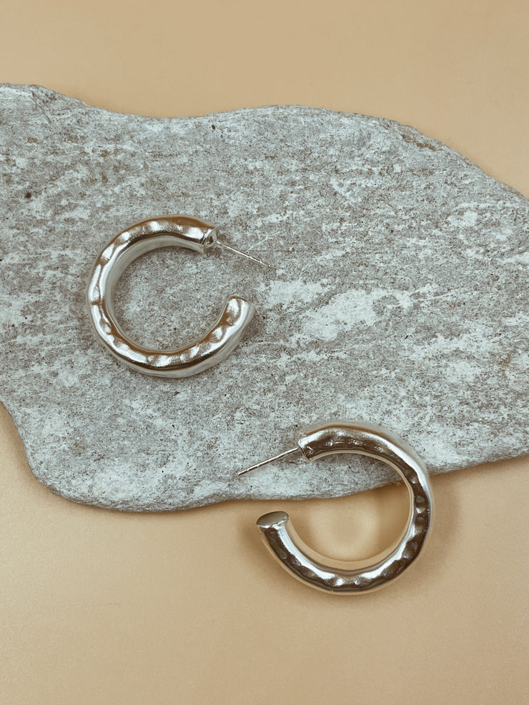 Lightly hammered ripple textured brass with silver rhodium plated small hoops. Chunky textured hoops that are light-weight and 90s inspired. AM to PM hoops suited for every occasion. Available in 3 ( three ) sizes - small, medium and big. 