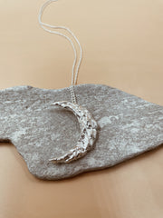 Wandering Crescent Moon Necklace in Silver Tone